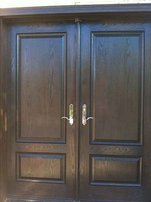 Wood grain Solid Double Doors with Multi Point Locks Installed by Windows and Doors Toronto