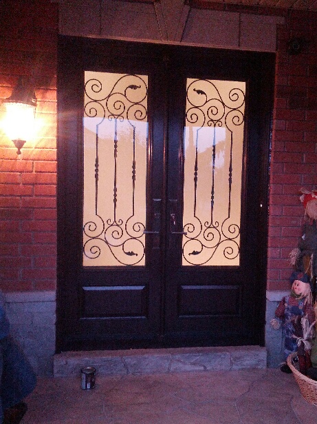 Fiberglass Doors-Extrior Double doors with Iron Art Design and multi point locks installed in Richmond Hill