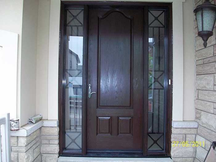 Executive Door, 8-Foot-Fiberglas Sigle-Solid-Door-with-2-Iron-Art-Side-Lights-installed-in-Aurora-Ontario by Windows and Doors Toronto