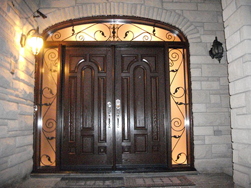 Wood Grain Doors Parliament Design with 2 Iron Arts Side Lites and Transom Installed by Windows and Doors Toronto