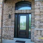 Wood grain Door Fiberglass with Stain Glass Design & Matching Arch Transom Installed by windows and doors toronto in Aurora