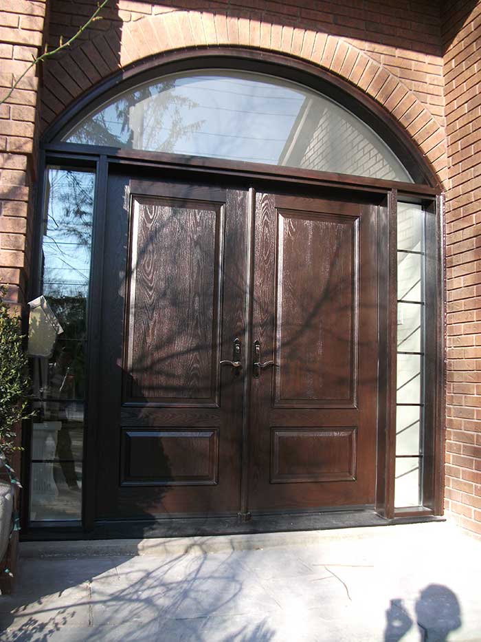 Wood grain Doors with IronArt and 2 side lites and Matching Arch Ransom Installed by Windows and Doors Toronto in Scarborough