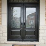Custom Doors, Woodgrain Fiberglass Double Iron Art Glass Design front Door with Nice Matching Arch ransom Installed by Windows and Doors Toronto in Richmondhill Ontario