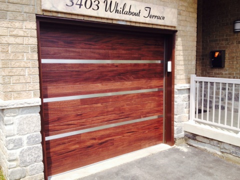 Custom Single Garage Door with Stainless Steel Design installed in Oakville