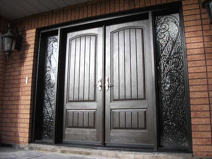 Rustic Doors, Woodgrain Double Solid Front Door with 2 Iron Art Side Lits Installed by Windows and Doors Toronto in Thornhill Ontario