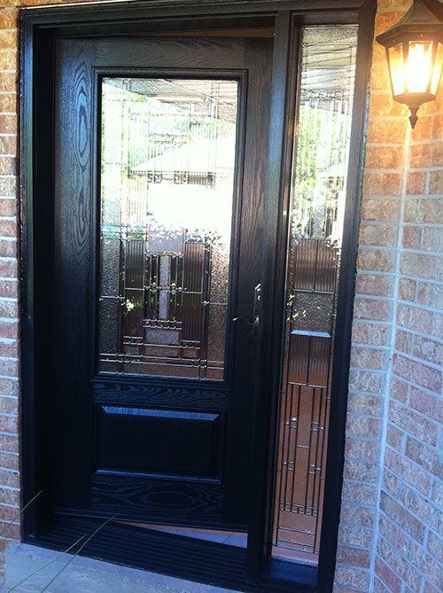 Stained Glass Woodgrain Fiberglass Single Door with Side Lite installed by Windows And Doors Toronto