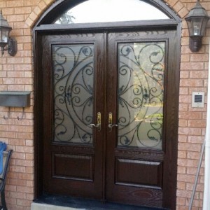 Wrought Iron Julieta Design Fiberglass Double Doors with Arch Transom installed in Oshawa by Windows and Doors Toronto