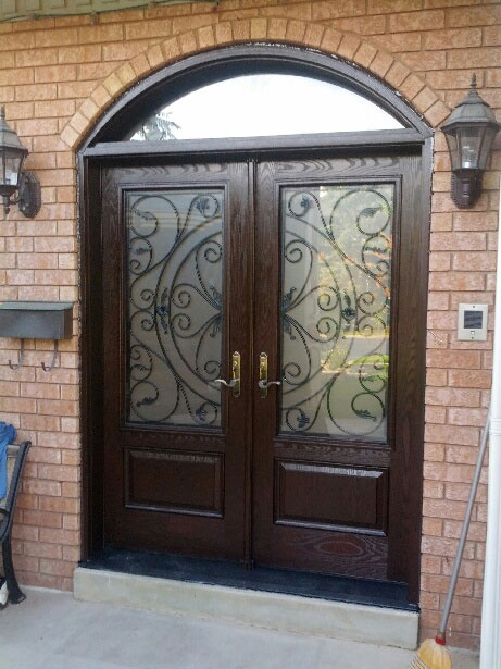 Wrought Iron Julieta Design Fiberglass Double Doors with Arch Transom installed in Oshawa by Windows and Doors Toronto