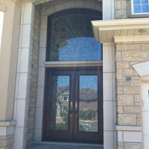 Wrought Iron Woodgrain Fiberglass Double Doors with Nice Iron Art Transom Installed in Richmond Hill by Windows and Doors Toronto