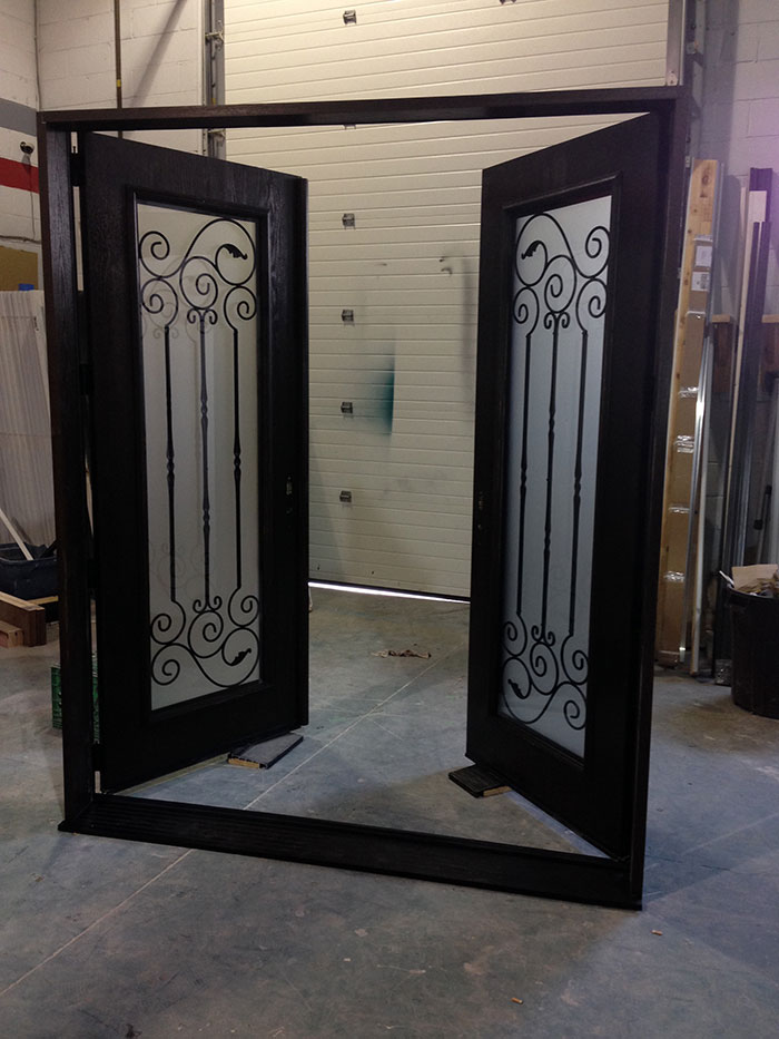 Fiberglass Woodgrain Doors with Wrought Iron Design & Frosted Glass Manufactured by Widows and Doors Toronto