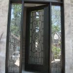 Wood Grain Doors-Single Fiberglass Woodgrain Glass Design Front Door with 2 Iron Art Side Lites and Matching Arch Transom Installed by Windows and Doors Toronto in Aurora