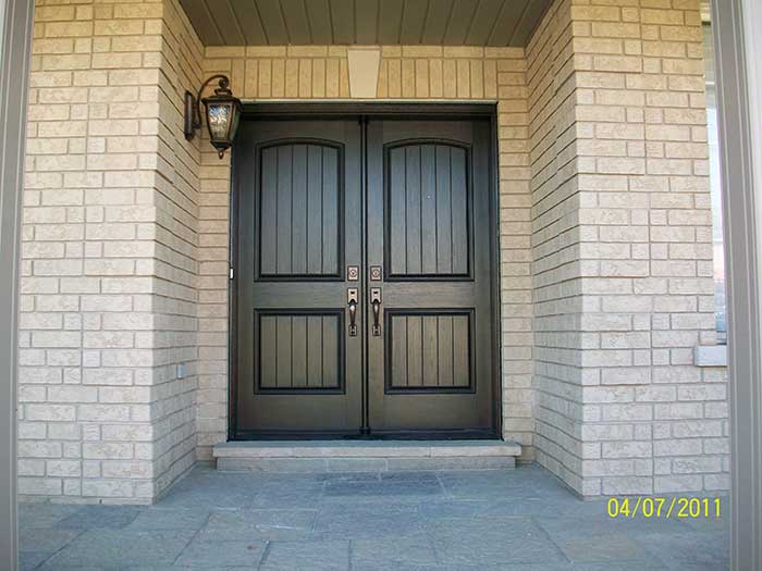 Wood grain Rustic Fiberglass Parliment Doors with Multi Point Locks Installed by Windows and Doors Toronto in Burlington