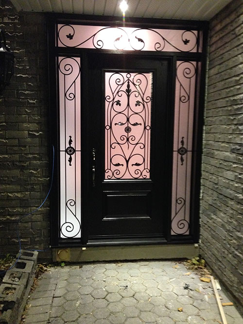 Wrought Iron Fiberglass Door with 2 side lites and transom installed in Richmond Hill by windowsanddoorstoronto.ca
