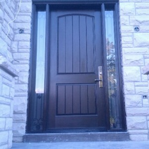 Fiberglass Door-Exterior Door-Rustic 2 panel Front Door with 2 Side lites & Iron Art Design with Frosted Bakcing Glass installed in New Market_ Ontario