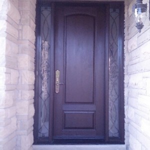 Fiberglass Woodgrain Executive Door with 2 Clear Side lites and Iron Art Design and Multi Points Lock installed Richmond Hill Installed by WIndows and Doors Toronto