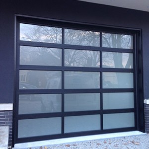 Oversized Aluminum Glass Garage Door in Custom Home in Oakville by windowsanddoorstoronto.ca