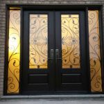 Wrought Iron Fiberglass Doors with 2 side lites and multi point locks installed in Richmond Hill