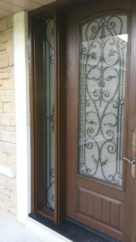 Rustic Wrought Iron Fiberglass Doors With 2 Side Lites Installed in Oakville