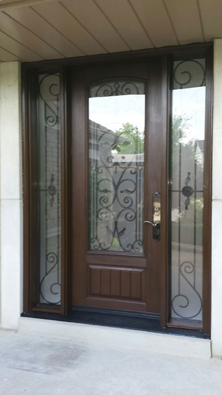 Wrought Iron Fiberglass Doors With 2 Side LItes Installed in Oakville